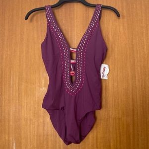 One piece swimsuit. Deep purple with pink, orange, white and green threading.